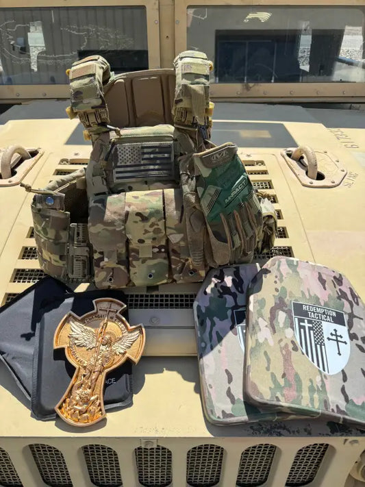 Military-style tactical vest with camouflage, American flag patch, tactical gloves, body armor