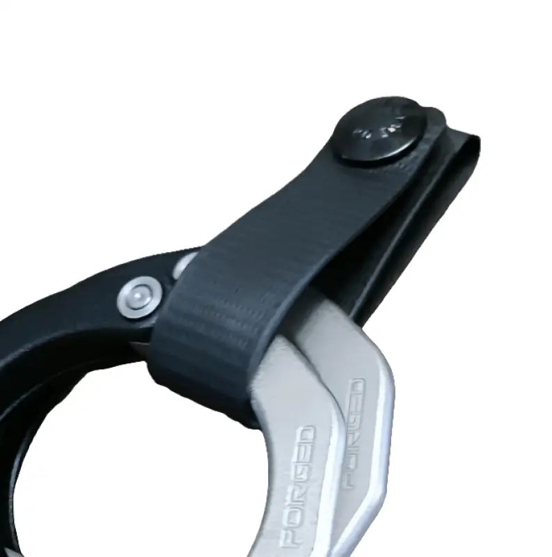 Black and silver bicycle brake lever on a Minimalist Cuff Holder for stylish functionality