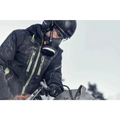 Motorcyclist in black winter gear with helmet beside K 1 PACE Battery Powered Rescue Power Cutter