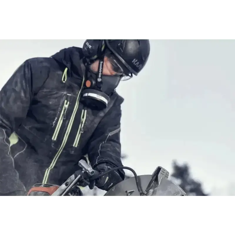 Motorcyclist in black winter gear with helmet beside K 1 PACE Battery Powered Rescue Power Cutter