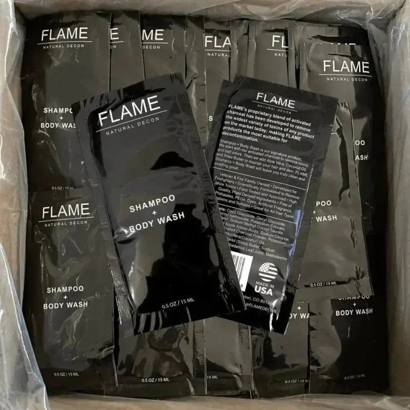 Flame Shampoo + Body Wash packets featuring naturally derived ingredients and activated charcoal