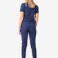 Navy blue women’s tuckable one-pocket scrub top with short sleeves and fitted pants