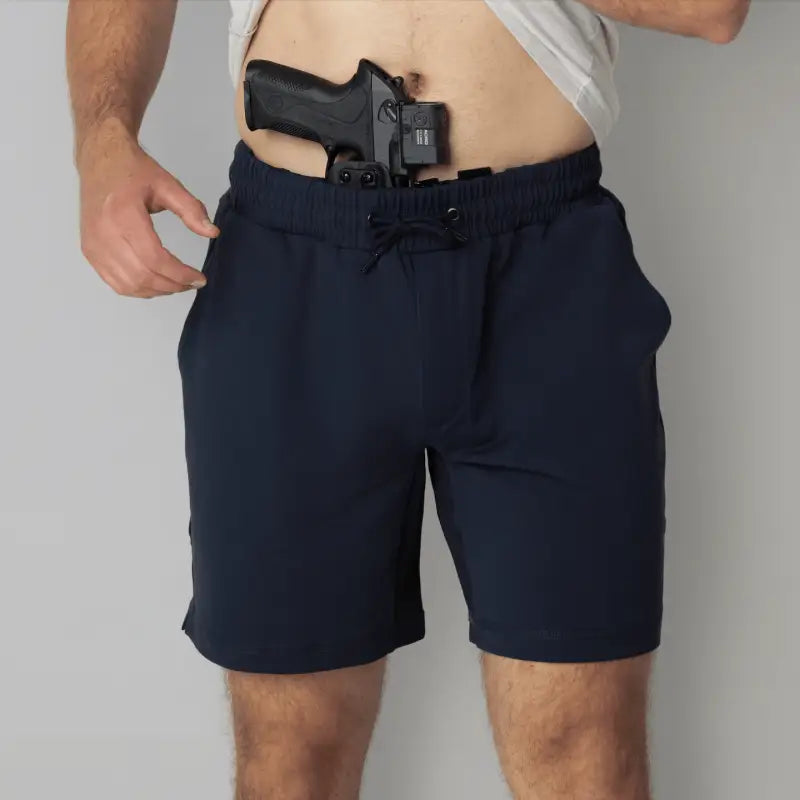 Navy blue Carrier Shorts Mk.II with concealed carry pocket, part of Arrowhead Tactical Apparel