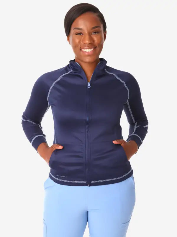 Navy blue women’s scrub jacket with contrast stitching for a stylish athletic look