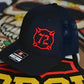 Navy blue Custom Richardson cap with red Maltese Cross and puff embroidery logo