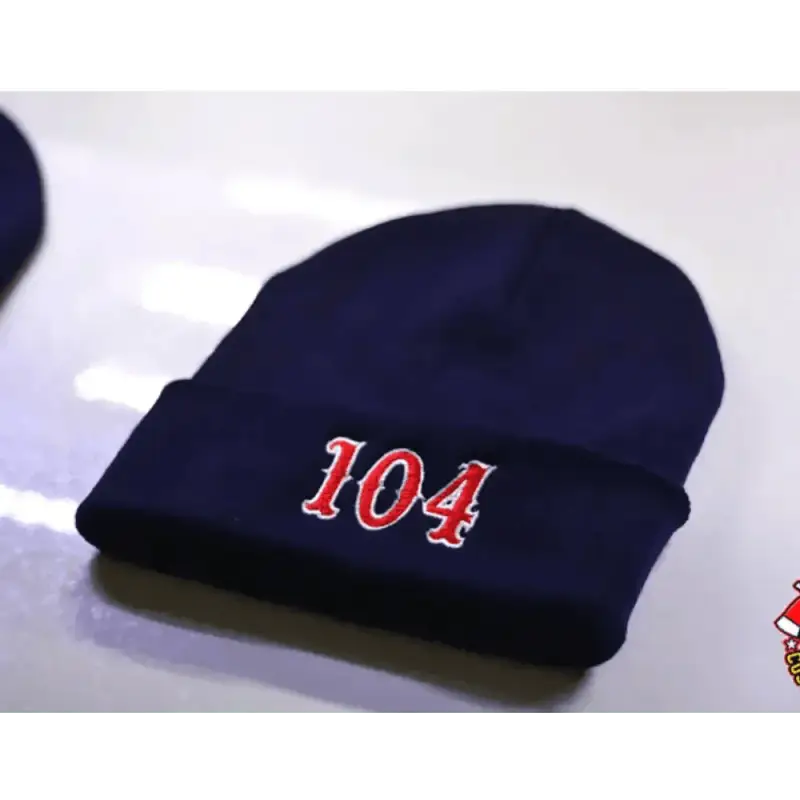 Navy blue two color beanie with red 104 numbers embroidered on the front