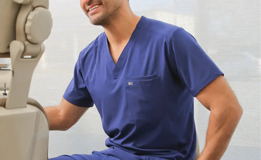 Navy blue Men’s Double-Pocket Scrub Top featuring a stylish V-neck design