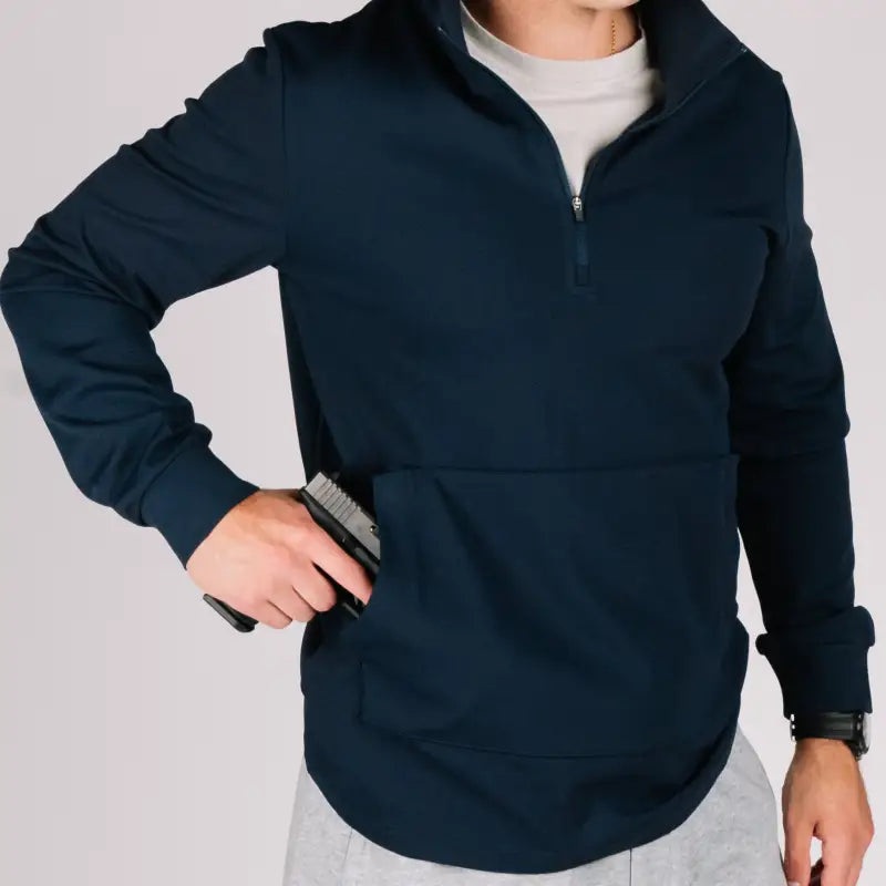 Navy blue durable quarter zip pullover with a hidden gun in the pocket for stylish security