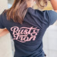 Navy blue woman’s staple tee featuring pink Rust & Iron text on the back