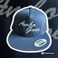 Navy blue and white trucker hat with Ambo Goes script lettering for first responders hats