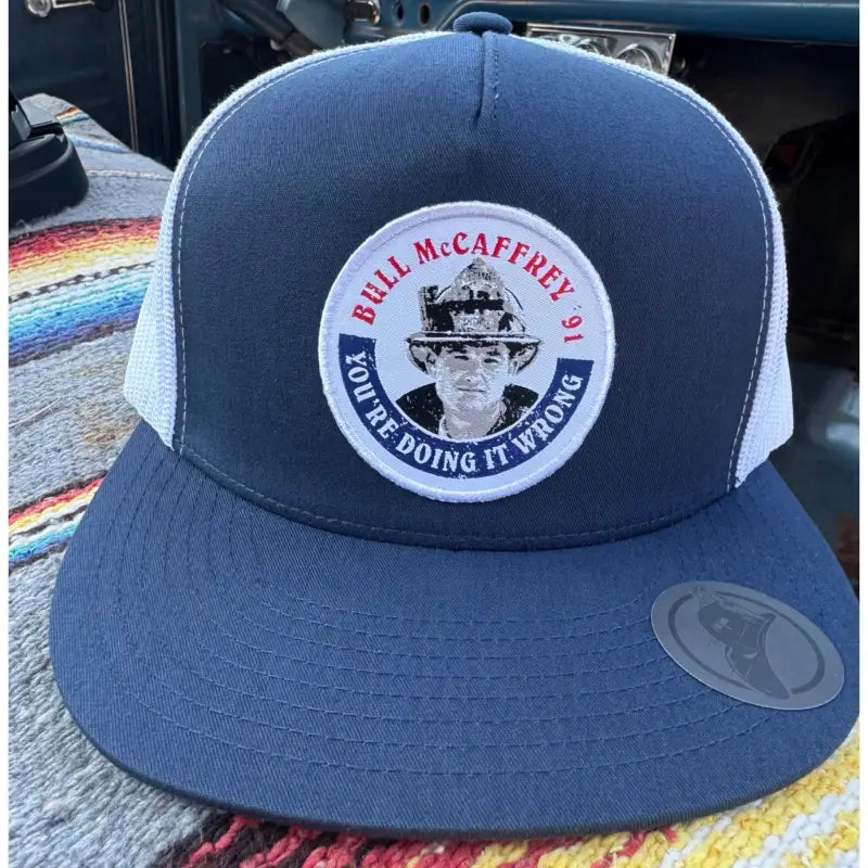 Navy blue and white Bull Truckee trucker cap with Bull McCaffrey patch for first responders