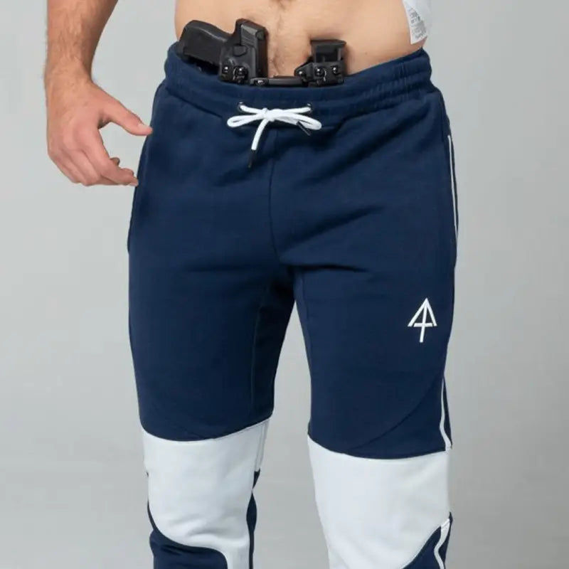 Navy and white Carrier Joggers Mk.II with concealed carry gun and retention belt