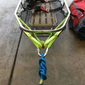 Neon green boat trailer with a braided blue rope and Multi-Loop Rescue Strap attached