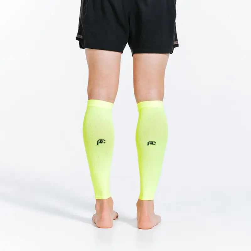 Neon yellow compression sleeves for calves enhancing performance and comfort