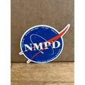 Parody sticker of NASA logo reading NMPD, ideal for first responders and rocket science fans