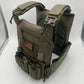 Olive drab large size body armor with modular plate carrier and magazine pouches