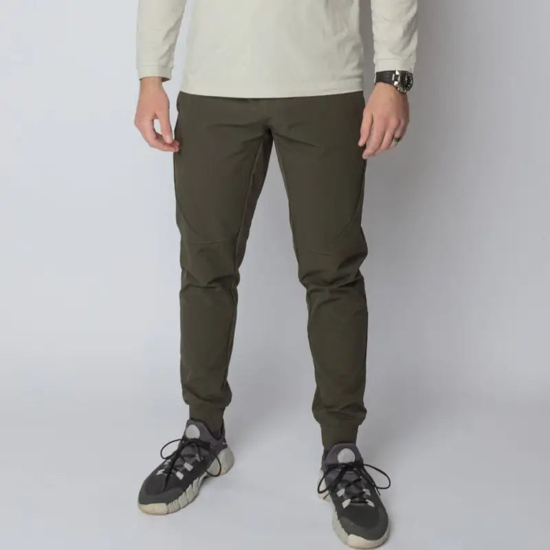 Olive green athletic joggers with concealed carry and carrier retention waistband for travelers