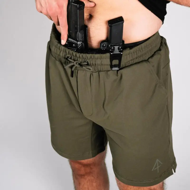 Olive-green Carrier Shorts Mk.II with concealed carry pocket and arrowhead tactical apparel