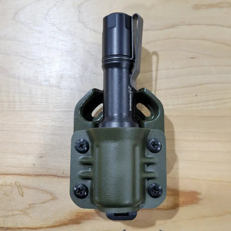 Olive-green MCH Duty Flashlight Carrier with black flashlight for duty flashlight use