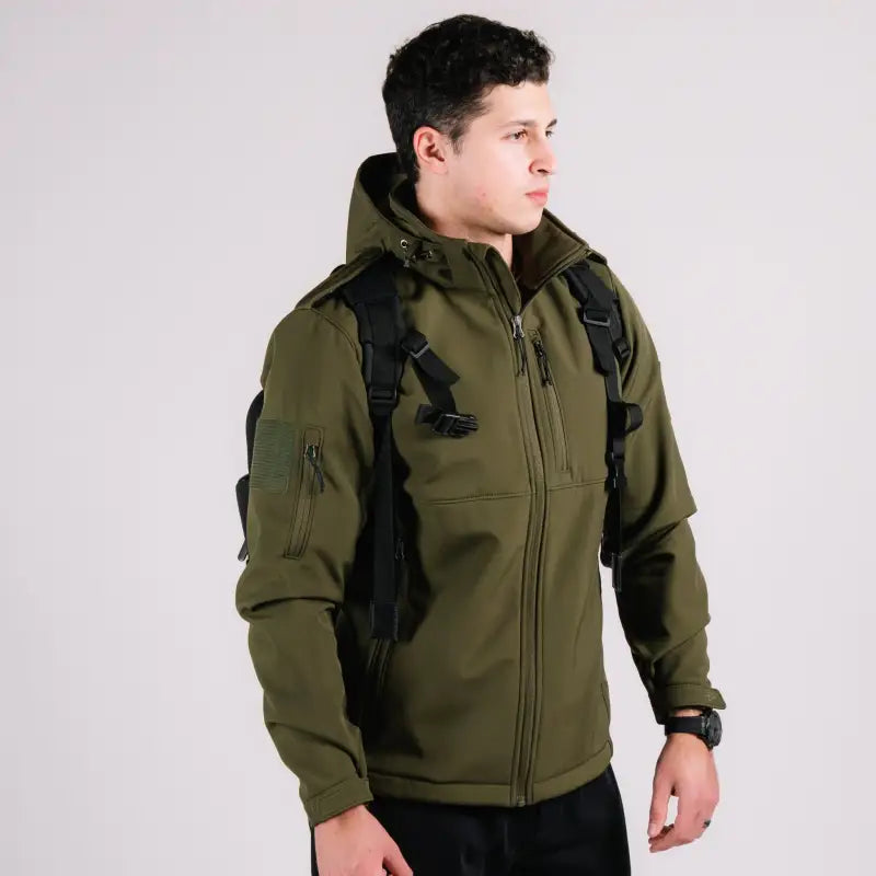 Olive green hooded softshell tactical jacket with hand pocket from Tactical Jacket Alpha