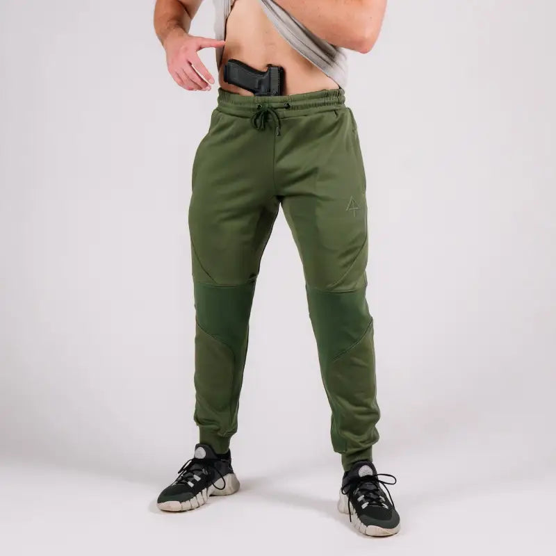 Olive green Carrier Joggers Mk.II with concealed carry, retention belt, and carrier retention