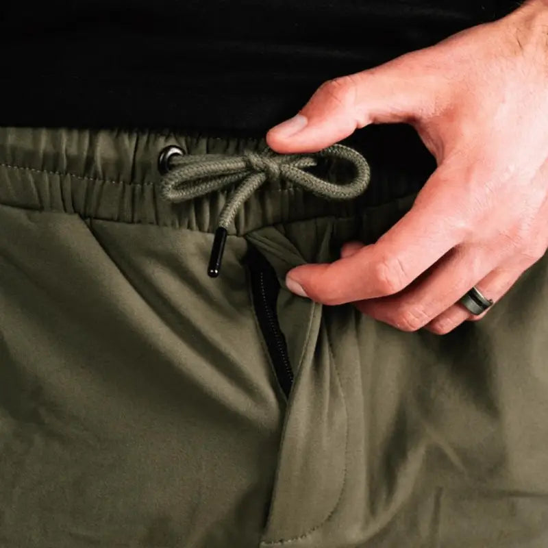 Olive green drawstring carrier shorts with concealed carry design from Arrowhead Tactical Apparel