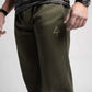 Olive green Carrier Sweatpants featuring patented carrier retention waistband and triangle logo