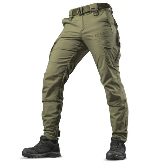 Olive green M-Tac Tactical Pants Aggressor Gen.II Flex with multiple pockets and black boots