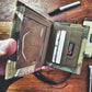 Olive green tactical wallet with card slots in Coyote Combat Leather design