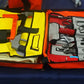 Open orange Crash Bag Kit with tools for emergency rescue and safety preparedness