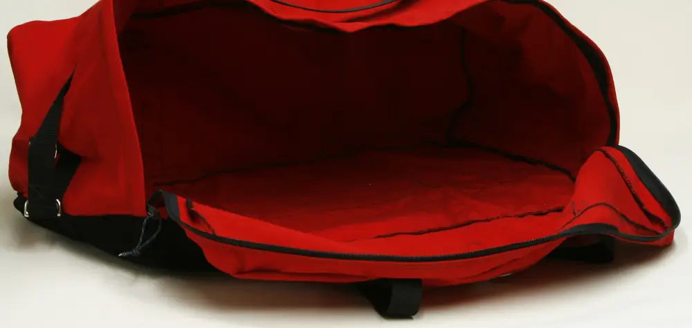 Open red and black turnout gear bag with side zipper for firefighter gear storage