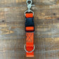 Orange and black adjustable dog collar with metal clip, ideal for first responders and firefighters