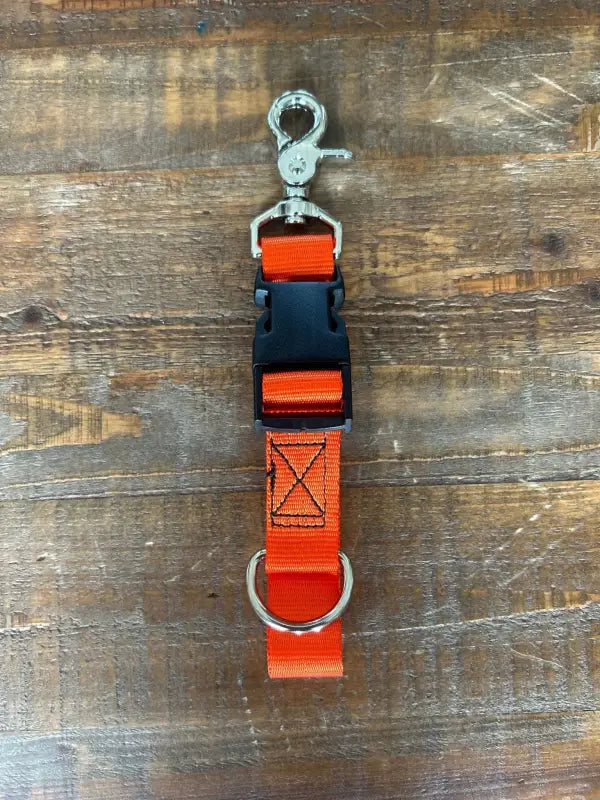 Orange and black adjustable dog collar with metal clip, ideal for first responders and firefighters