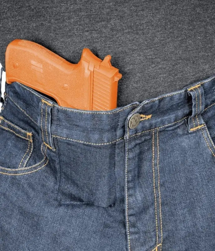 Orange handgun in waistband of blue jeans from Asset Tactical Jeans collection