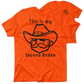 Orange T-shirt with cowboy graphic from My Second Rodeo Safety Yellow T-Shirt collection