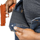 Orange training pistol drawn from Asset Tactical Jeans for optimal accessibility