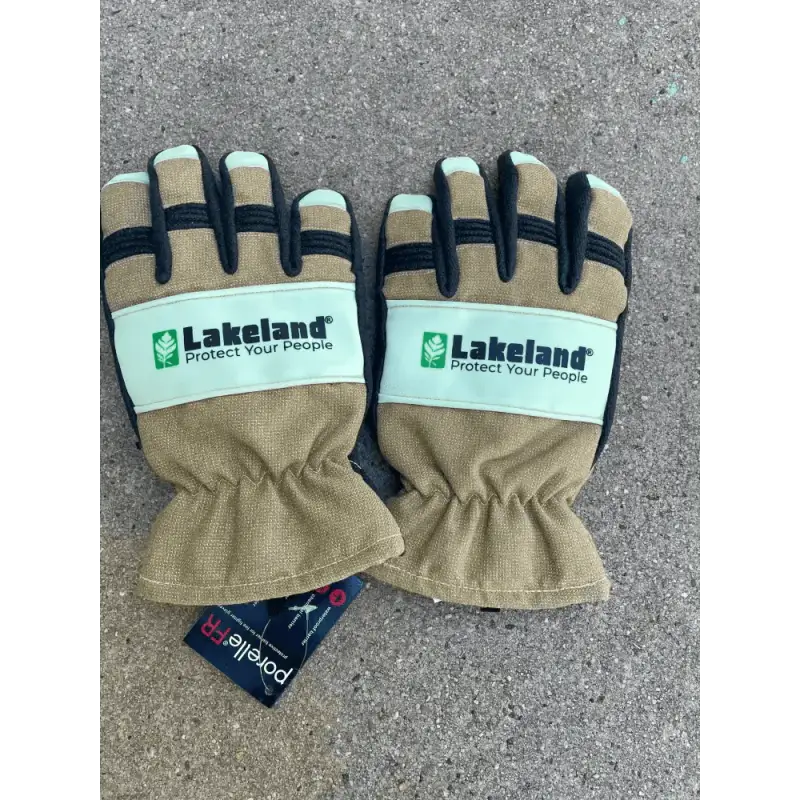 Tan and black Lakeland Structural Glow dark firefighting gloves with mint green accents