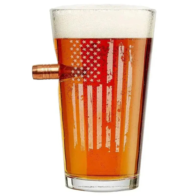 Patriotic Pint Glass featuring an American flag design and a bullet in its side