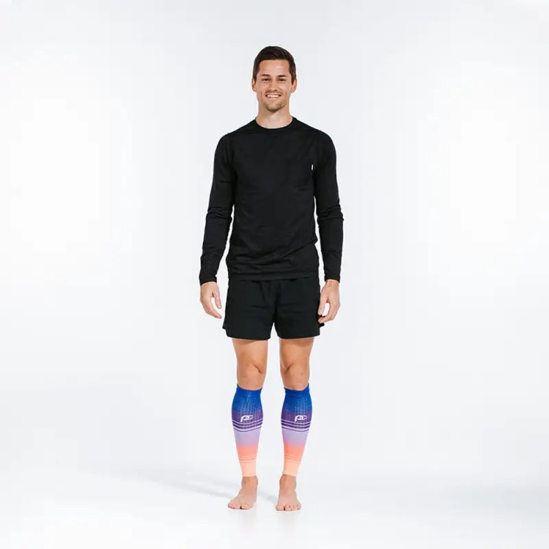 Person in black athletic wear showcasing Florida Skies compression calf sleeves