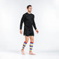 Person in black athletic wear showcasing Calf Compression Sleeves with multicolor stripe design
