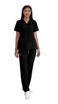Person in Women’s Gentle Stretch Slim Fit Zipper Set with black scrubs and white shoes
