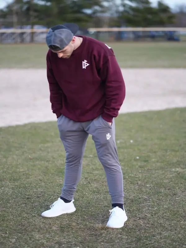 Person in burgundy sweatshirt and gray joggers - Iron, perfect for first responders