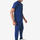 Person in navy blue medical scrubs and white sneakers showcasing men’s double-pocket scrub