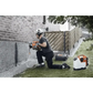 Person using Husqvarna 540i battery powered core drill kit next to a brick wall