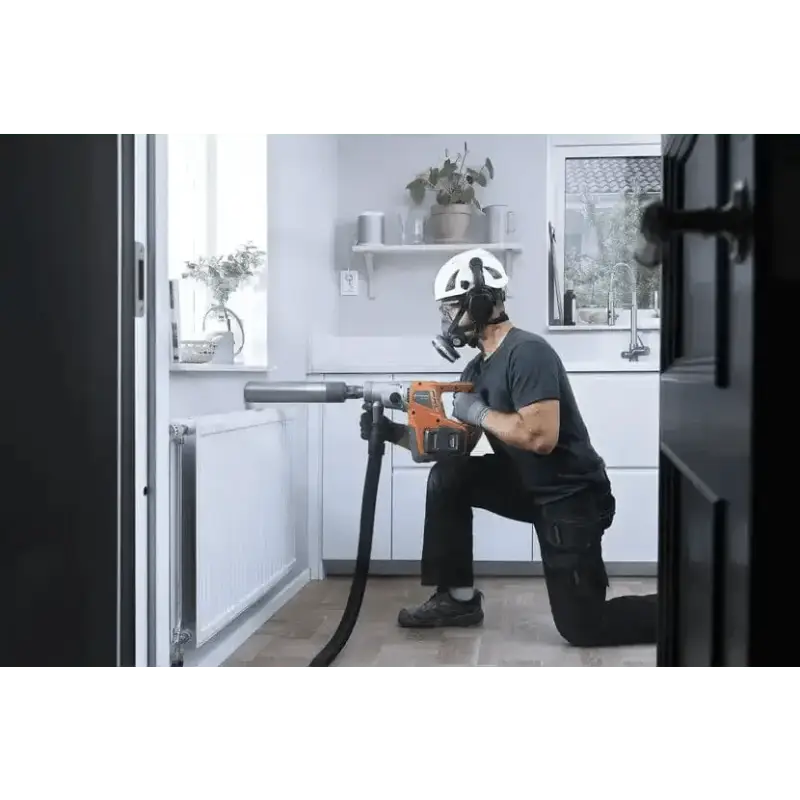 Person in protective gear using Husqvarna 540i battery powered core drill kit