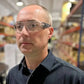 Person in dark collared shirt wearing METEL M50 safety glasses lightweight for protection