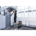 Person using Husqvarna 540i battery powered core drill kit on a step ladder for installation