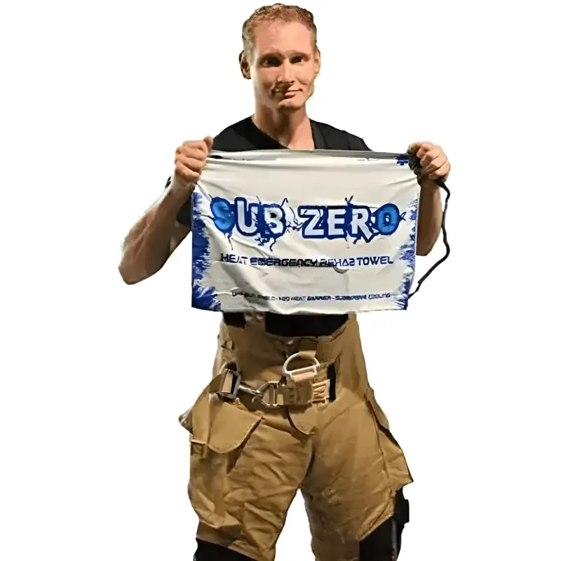 Person in tan cargo pants holding Subzero Cooling Towel with H2O Heat Barrier