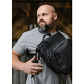Black tactical sling bag with multiple compartments for EDC CCW and armored fast access