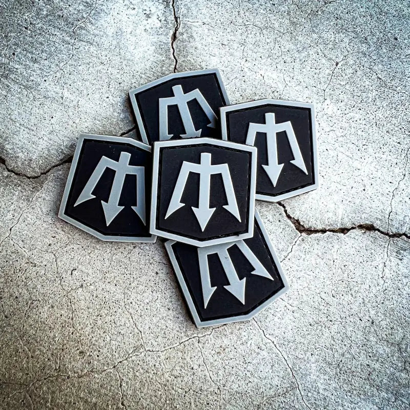 Pile of Trident-Emblazoned PVC Patches for Firefighter and First Responder Gear